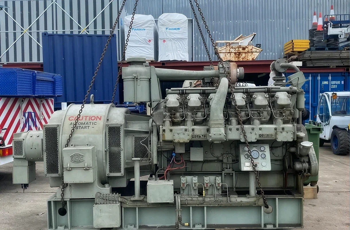 Large engine suspended by chains