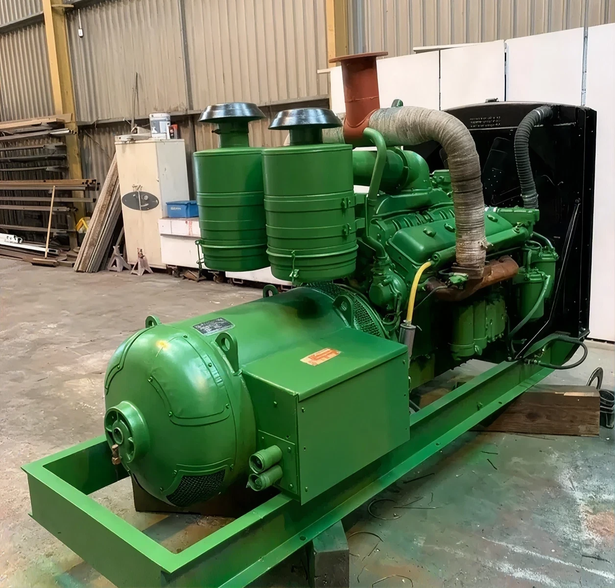 Large green machinery inside building